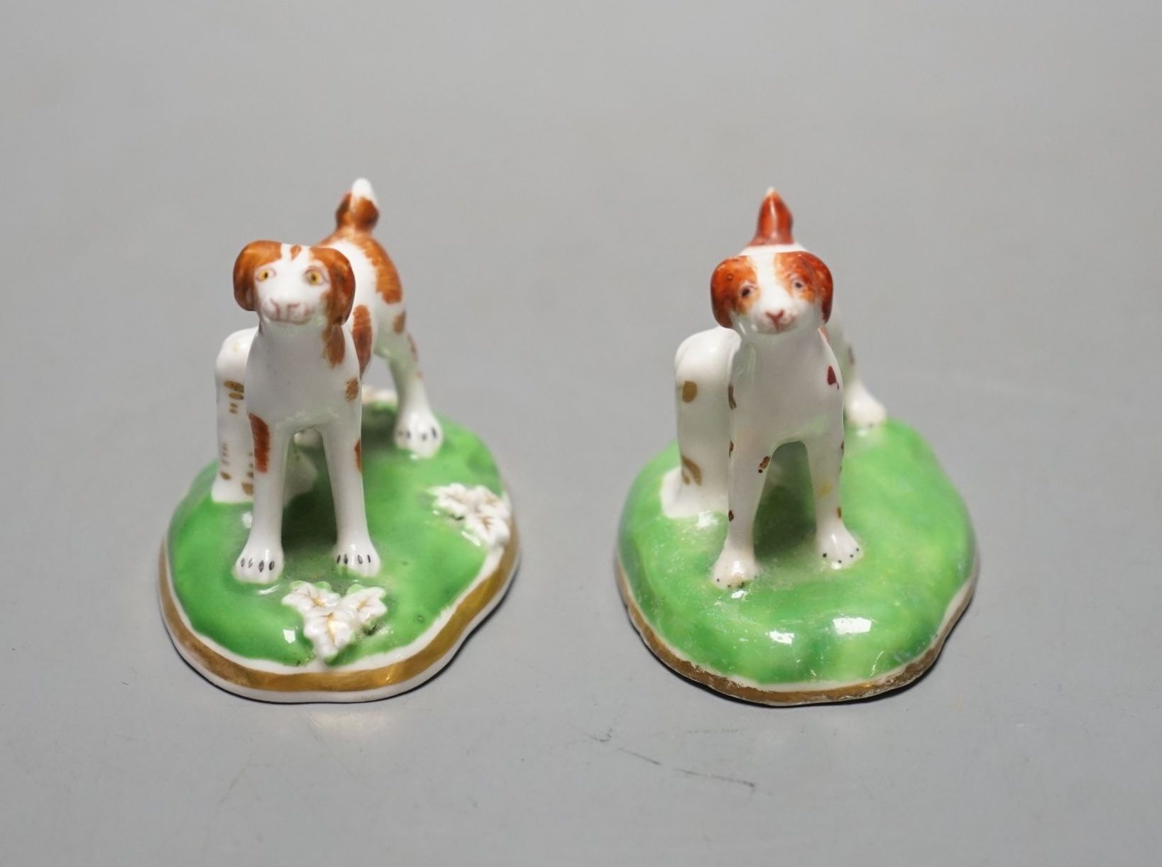 Two Chamberlains porcelain toy models of a pointer, c.1847-52, one with leaf moulded flat base, impressed CHAMBERLAINS, the other with plain concave base and unmarked, cf. Dennis G.Rice, Dogs in English porcelain, colour